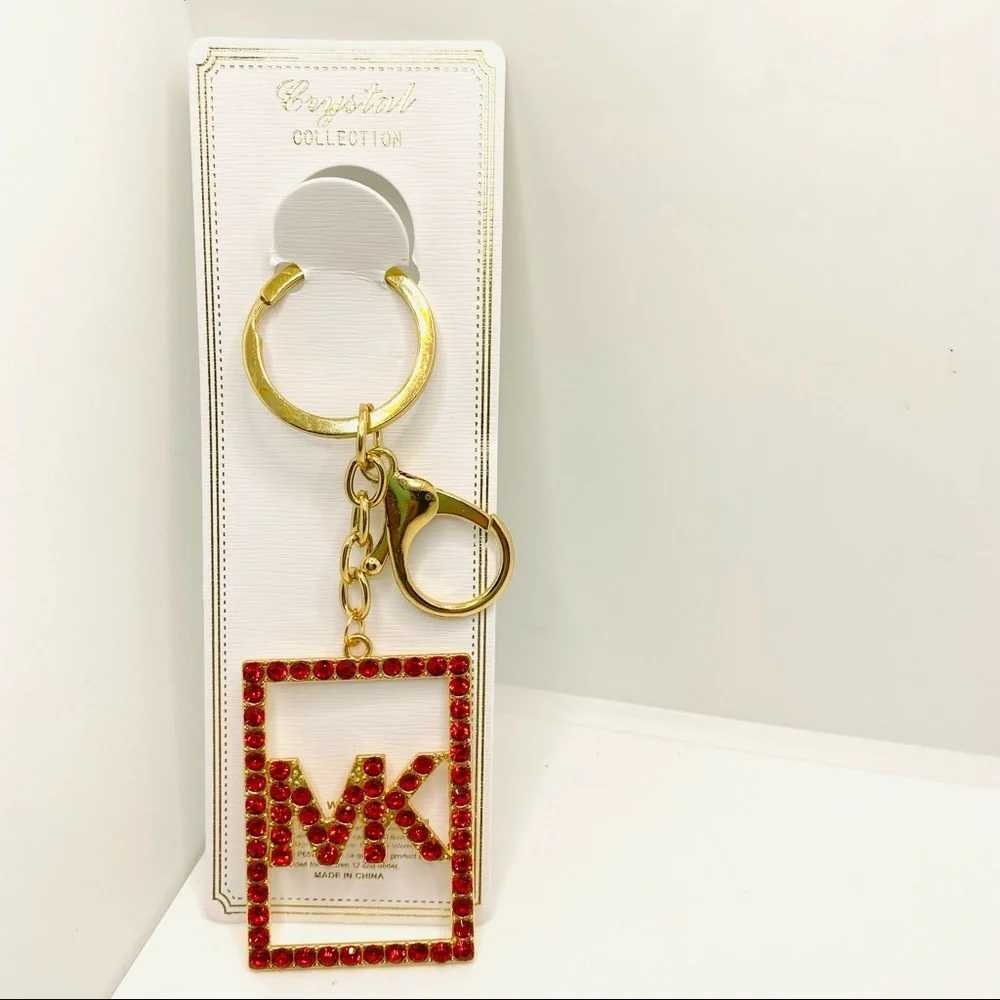 Purse Charm Key Chain MK in Red Crystals set in golden tone.